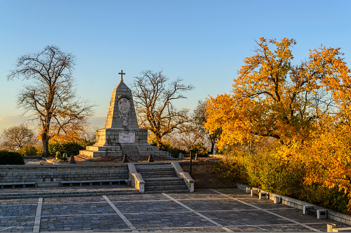 Monument of Tsar Alexander I with fall foliage in Plovdiv, Bulgaria.