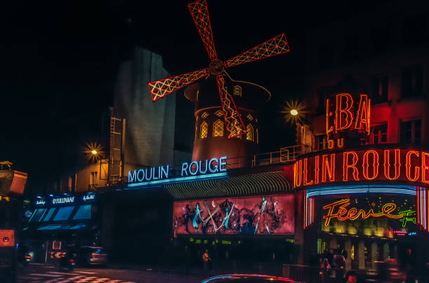 Moulin rouge by night Paris, France - May 2012. A night-shot of Moulin Rouge place pigalle stock pictures, royalty-free photos & images