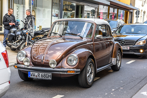 Germany, Limburg - 2 April 2017: brown VW Volkswagen Beetle type 1 1302 1971 is parked in town center, oldtimer meeting event in the center of Limburg an der Lahn