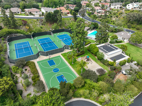 Aerial view of recreational facilities with tennis and pool in private residential community in La Jolla, Califronia, USA. September 21st, 2022