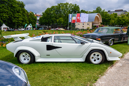 Baden-Baden, Germany - 14 July 2019: white Lamborghini Countach 1974 sports car is parked in town center, oldtimer meeting event in the center of Baden-Baden
