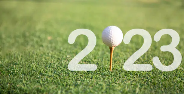 Photo of Happy New Year 2023 on the green golf for new healthy. copy space. Healthy and Holiday Concept