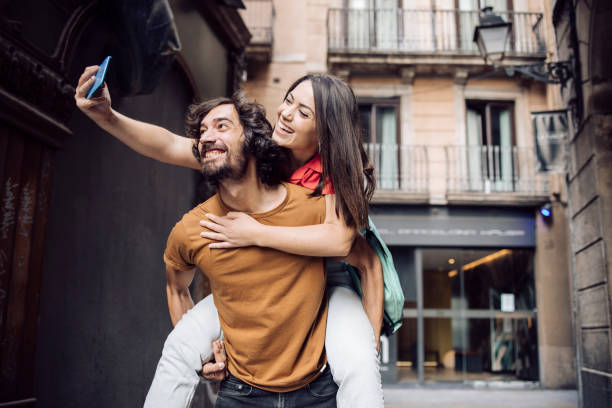 istock Couple taking a selfie and having fun on their vacation 1440863318