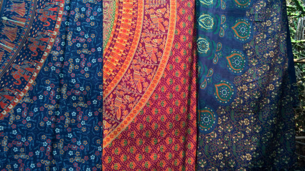 Indian natural cotton fabrics with printed pattern. Background of blue and red fabrics with a pattern