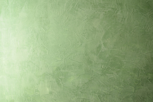 Green venetian stucco texture. Venetian plaster background. Wall texture