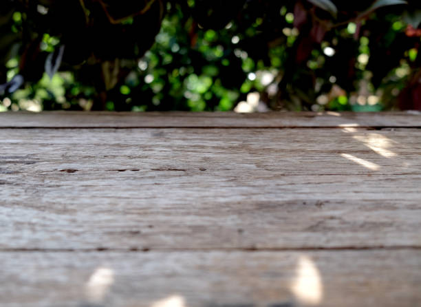 istock Wood table and leaf background. Mockup for display of product 1440875581