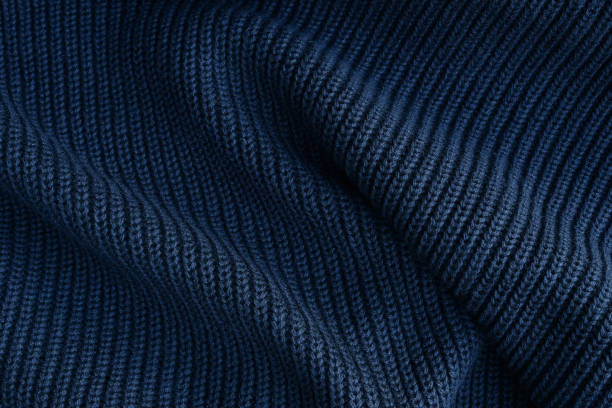 istock Black knitted fabric texture background. Abstract modern Knit texture black color, top view 1440877799