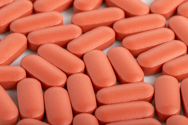 istock Orange medical pills full frame background 1440878891