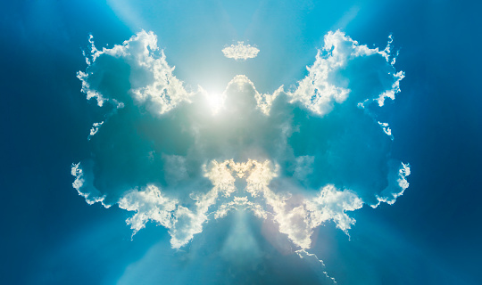abstract simetrey clound on sky as a angle wing on blue sky  and light over cloud as good light