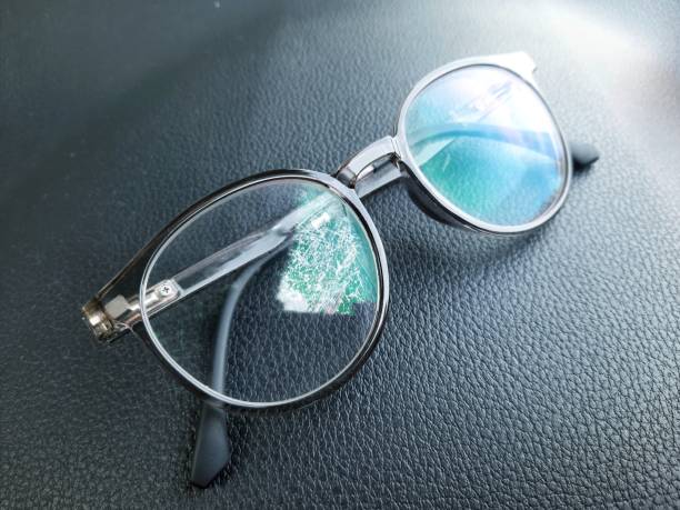 istock Glasses on the dashboard of the car 1440882134