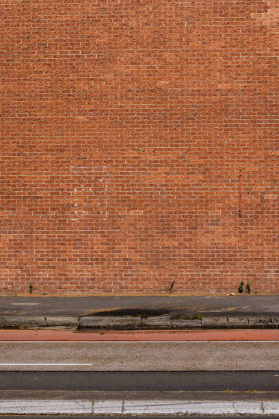 istock Part of a large orange and red brick wall 1440882909
