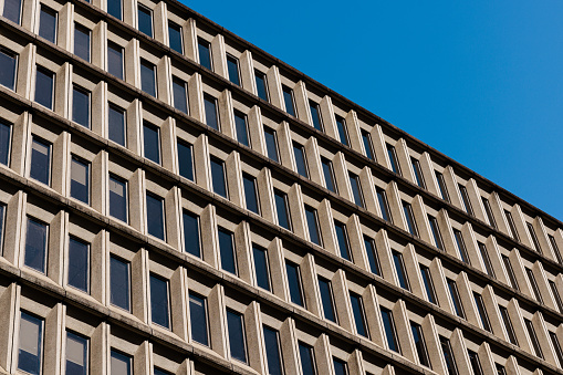 Rows of windows of a city office building.
