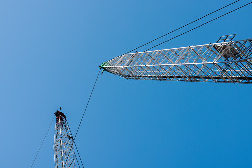 Large crane and blue sky.