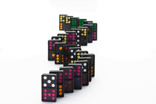 Dominoes background.Dominoes on black. colorful dominoes.