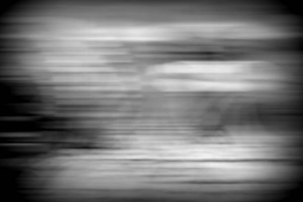 istock Abstract Black and White Motion Blur Background with Gains. 1440891473