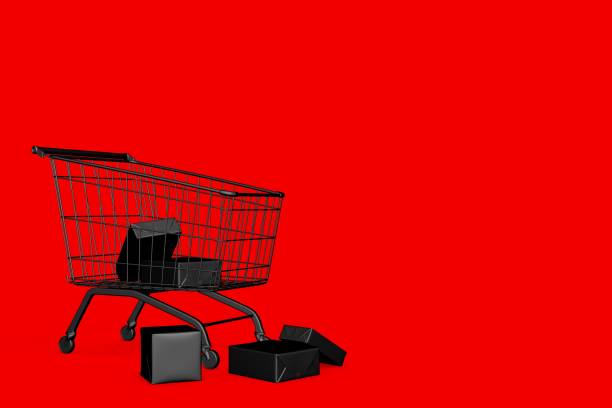 istock Black gift box in shopping cart on red background, copy space. black friday concept 1440891696