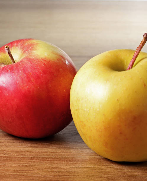 istock red and yellow apple on a wooden background 1440893408