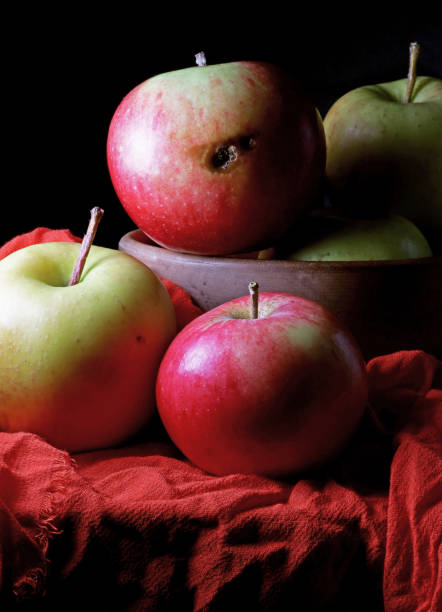 istock still life with red and yellow apples on a red fabric background 1440893433
