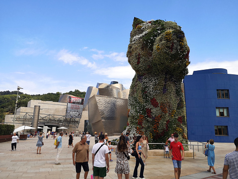 Bilbao, Spain. 03 18 2019;  Jeff Koons puppy ,world's largest flower sculpture named  Puppy (1992)  at Guggenheim museum at morning, Bilbao, Spain.