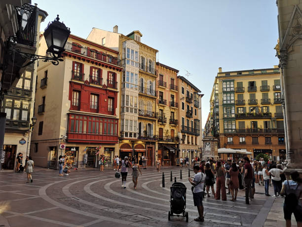 People walking in the Casco Viejo of Bilbao, Spain People walking by the old fashioned residential buildings in the Casco Viejo of Bilbao, the largest city in the Basque Country, on the north coast of Spain. Casco stock pictures, royalty-free photos & images