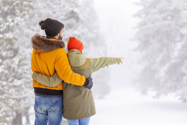 istock Couple spending time outdoors on snowy winter day 1440897635
