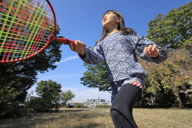 istock Japanese student girl playing badminton (8 years old) 1440902055