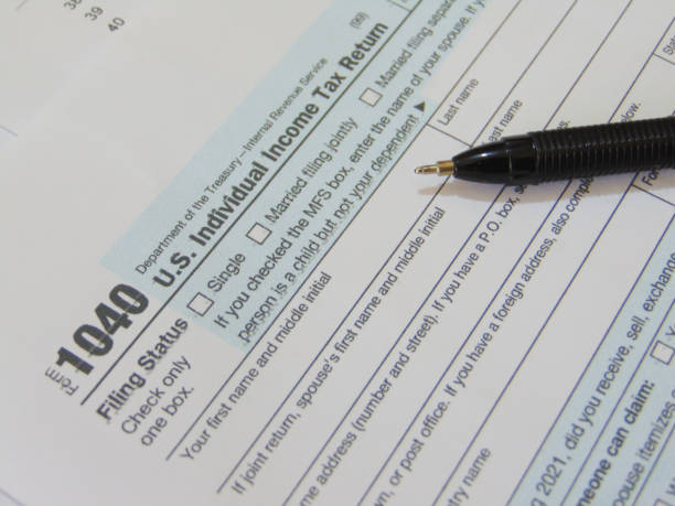 istock 1040 2021 IRS tax forms with pen 1440902589