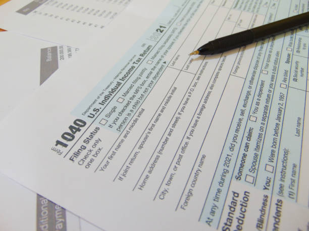 istock 1040 2021 IRS tax forms with pen 1440902606