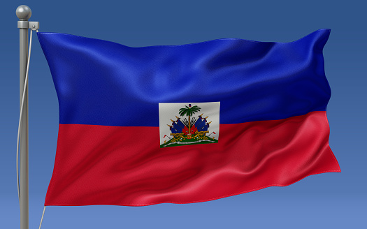 Haiti flag waving on the flagpole on a sky background
