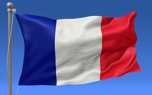 France flag waving on the flagpole on a sky background