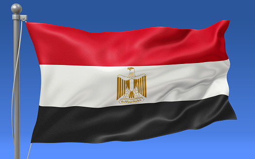Egypt flag waving on the flagpole on a sky background