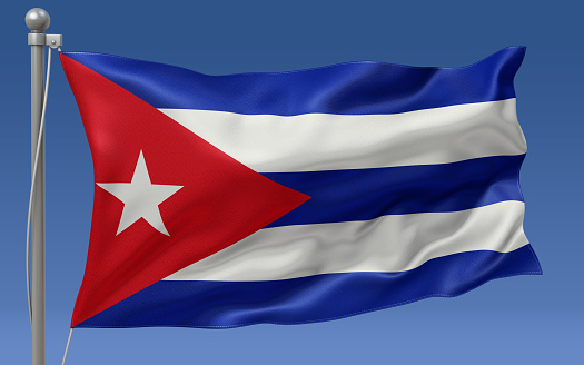 Cuba flag waving on the flagpole on a sky background