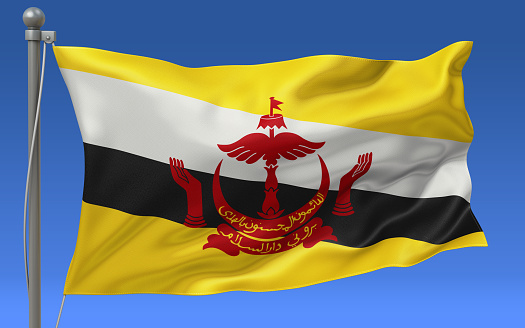 Brunei flag waving on the flagpole on a sky background