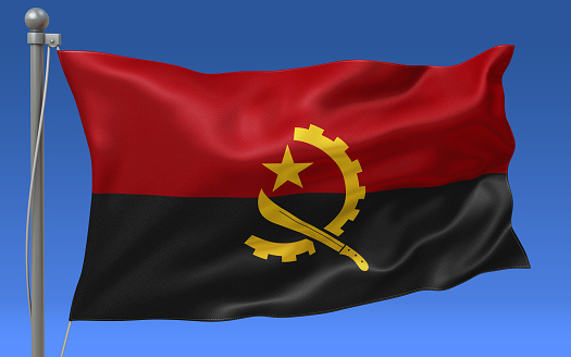 Angola flag waving on the flagpole on a sky background