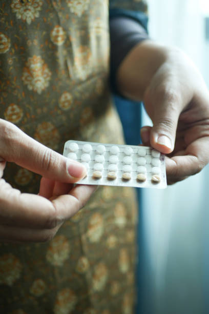 istock female hand golding birth control pills 1440904832