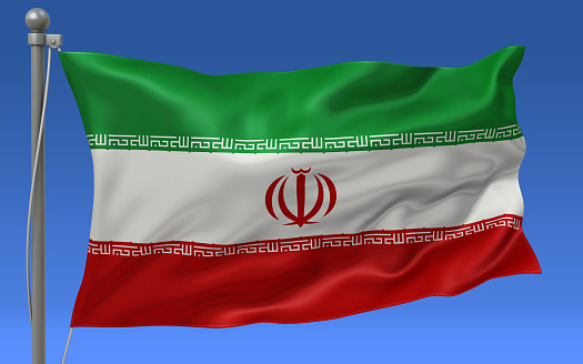 Iran flag waving on the flagpole on a sky background