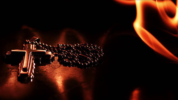 istock Christian Symbol Cross on Fire 1440908892