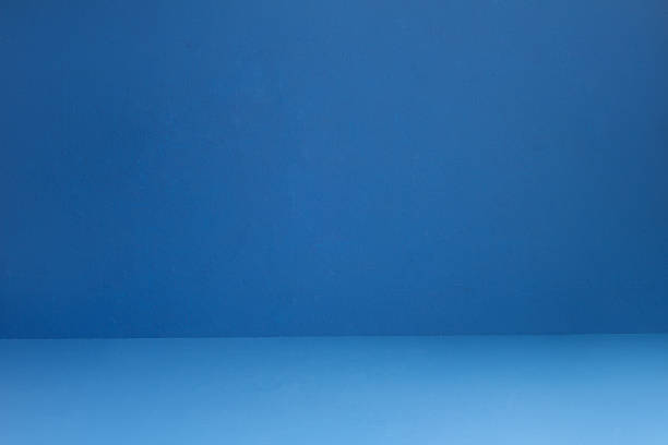 istock Blue textured wall and floor with some small white spots and dirt. Artistic painted background. 1440908932