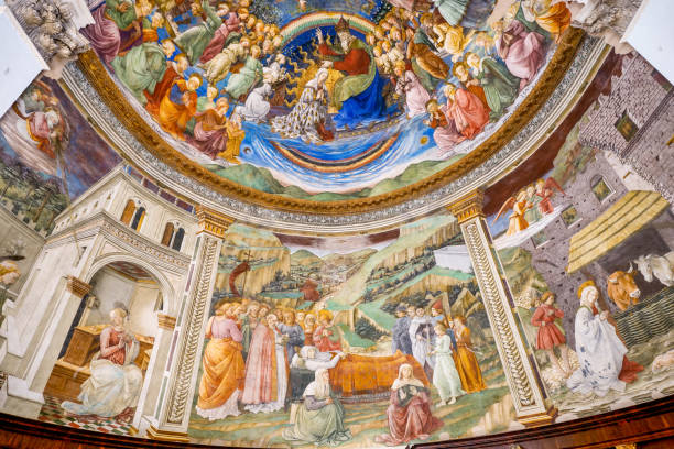 The stunning apse frescoed by Filippo Lippi inside the Duomo in the medieval town of Spoleto in Umbria A view of the stunning frescoes inside de apse of the Duomo of Spoleto, a medieval town in the Umbria region, central Italy. The frescoes, depicting the Stories of the Virgin, were painted by Filippo Lippi between 1467 and 1469. The Duomo, or Cattedrale di Santa Maria Assunta (Cathedral of Assumption of the Blessed Virgin Mary), was built starting from 1067 in Romanesque and Lombard style and consecrated in 1198. Spoleto, one of the most visited medieval cities in Italy, hosts the Festival of the Two Worlds, a world-famous event that brings together hundreds of artists, musicians, classical dancers and opera singers every year. The Umbria region, considered the green lung of Italy for its wooded mountains, is characterized by a perfect integration between nature and the presence of man, in a context of environmental sustainability and healthy life. In addition to its immense artistic and historical heritage, Umbria is famous for its food and wine production and for the high quality of the olive oil produced in these lands. Super wide angle image in high definition format. medieval art the annunciation stock pictures, royalty-free photos & images