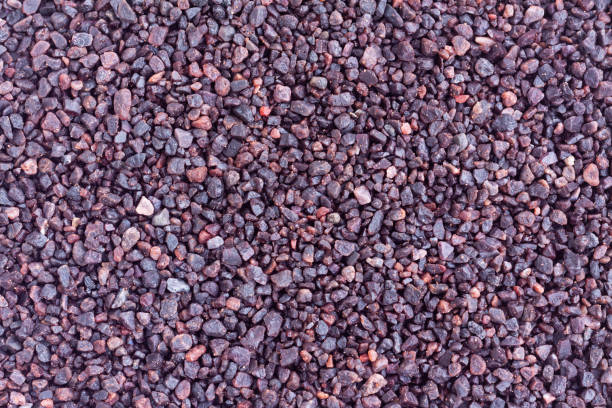 istock Black himalayan salt grain background, Black salt, Food ingredient 1440911019