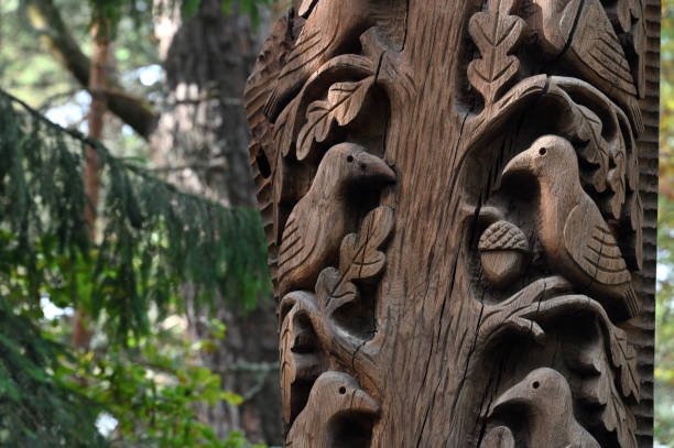 Juodkrante, Lithuania - August 24, 2022: Old wooden sculptures in the forest. Witch Hill park in Juodkrante, Lithuania. The Hill of Witches is an outdoor sculpture gallery.