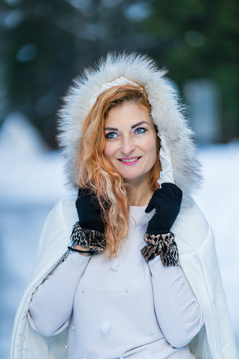 Portrait of beautiful happy woman in winter time.