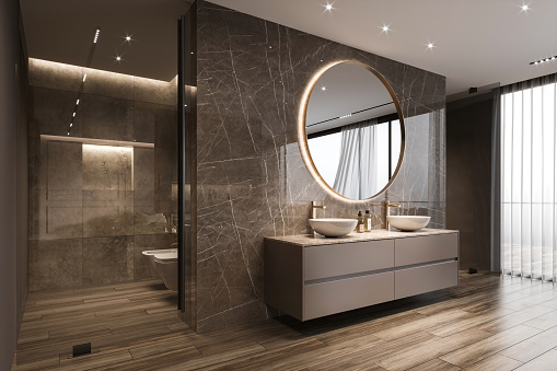Modern bathroom interior with shower cabin. Large round mirror, marble wall, sink, shower and  window. Render.