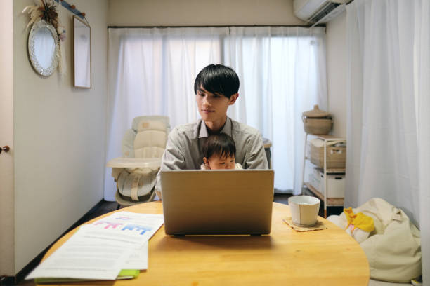 istock Father working from home with baby 1440919382