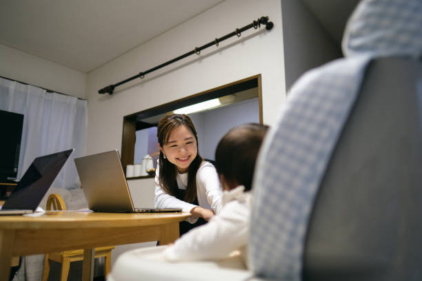istock Working mother talking to baby 1440919432