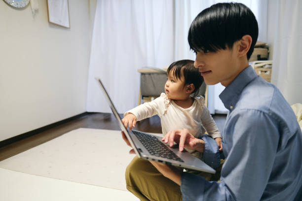 istock Father working at home with baby 1440919452