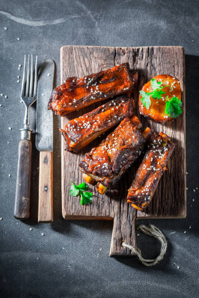 istock Hot and spicy roasted ribs served with mashed potatoes. 1440921359