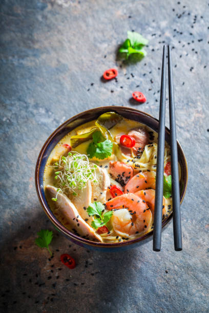 istock Hot Malaysian Soup with prawns and chicken. 1440921440
