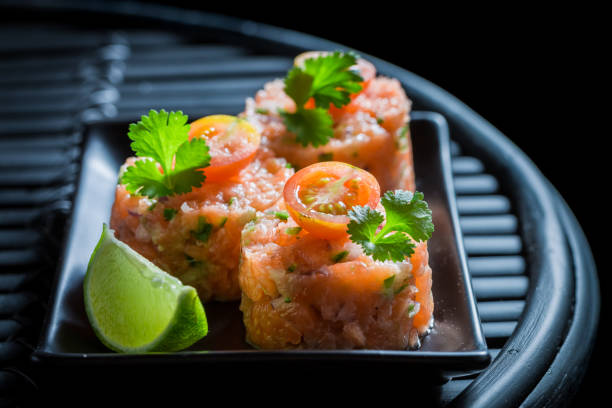 istock Fresh and raw salmon tartare with lime and coriander. 1440921868