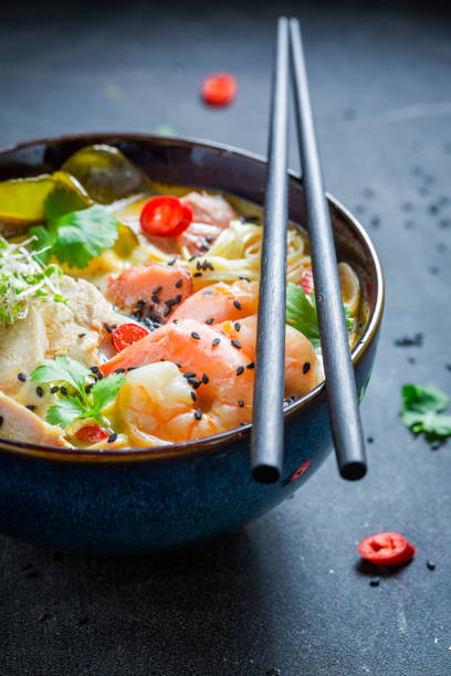 istock Spicy Malaysian Soup with prawns and chicken. 1440922393